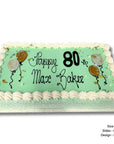 Large rectangular cake with green background and white border, featuring 'Happy 80th Max Baker' text.