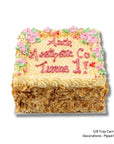 Square carrot cake with piped flowers
