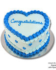 Blue baby shower cake with piped blue earts and blue piping on love heart cake