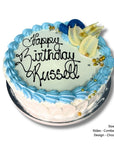 Birthday cake with blue icing and 'Happy Birthday Russell' text on a white background