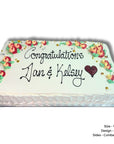 Large pretty cake with floral design and 'Congratulations Dan & Kelsey' text on a white background
