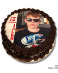 Chocolate cake with edible image of a person wearing sunglasses and a graphic t-shirt, with text 'Happy 12th Birthday Jacko'.