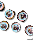 Vanilla cupcakes with pink icing and Frozen-themed edible images on a white background