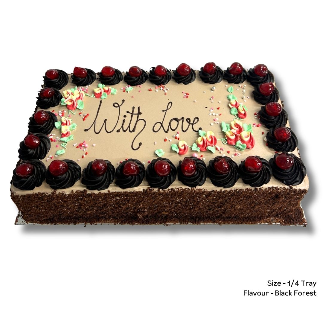 A rectangular black forest cake with chocolate frosting, decorated with piped dark chocolate rosettes topped with red cherries around the border, and red and green floral decorations with the words 'With love' written in the center. A size and flavor label is visible in the bottom right corner.
