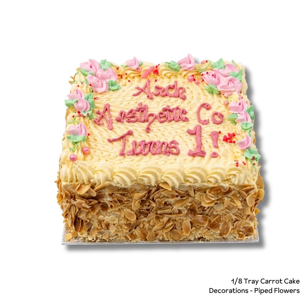 Square carrot cake with piped flowers