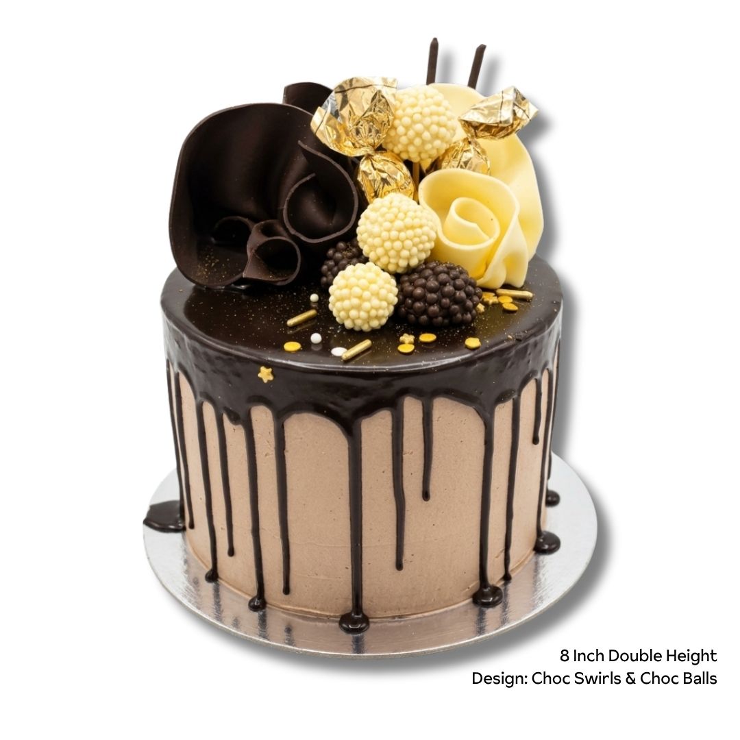 An 8-inch double height chocolate drip cake with chocolate frosting, decorated with dark chocolate and white chocolate swirls, chocolate pearls, and gold sprinkles, shown on a silver cake board against a white background.