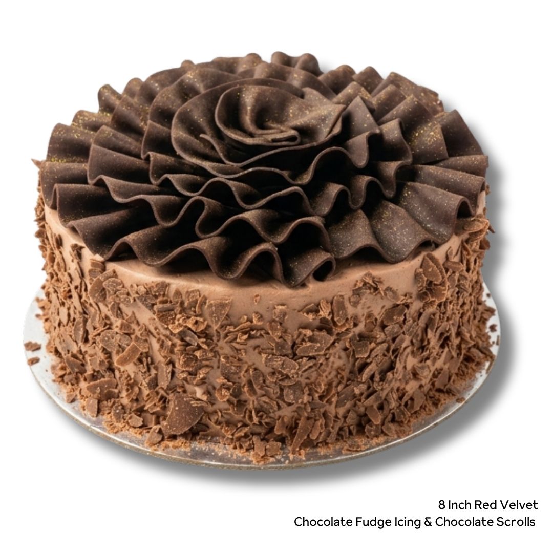 8 Inch Red Velvet Cake with Chocolate Icing, Chocolate Shavings and Chocolate Scrolls on top. 
