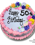 Decorative cake with pink frosting, colorful flowers, and 'Happy 50th Birthday' text on a white background.