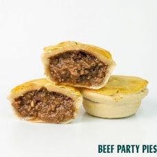 Three beef party pies on a white background, with two pies cut open to show the savory meat filling. The text 'BEEF PARTY PIES' is written in teal at the bottom right.