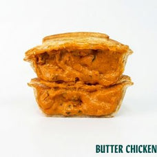 Two stacked butter chicken pie in a golden-brown sauce, shown on a white background with the text 'BUTTER CHICKEN' in the bottom right corner.