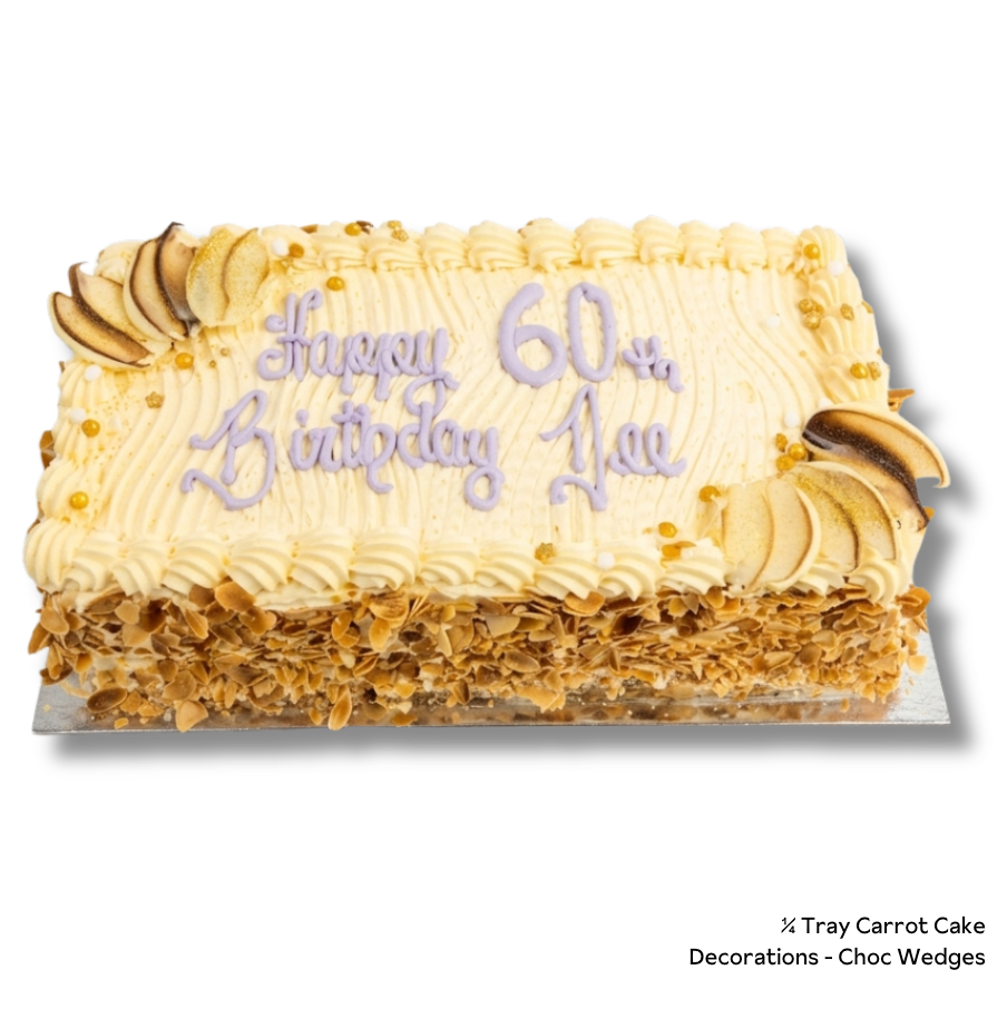 A rectangular carrot cake with cream-colored frosting, piped borders, chocolate-chip decorations, and purple icing text reading 'Happy 60th Birthday Ace.' The cake sits on a white background with a small text note in the lower right indicating carrot cake and choc wedges.