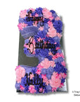 Decorative cake number '3' with pink and purple flowers and 'Happy Birthday' text on a white background.
