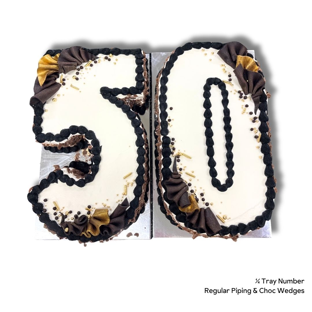 A birthday cake shaped into the number 50 with chocolate piping and gold and chocolate wedges