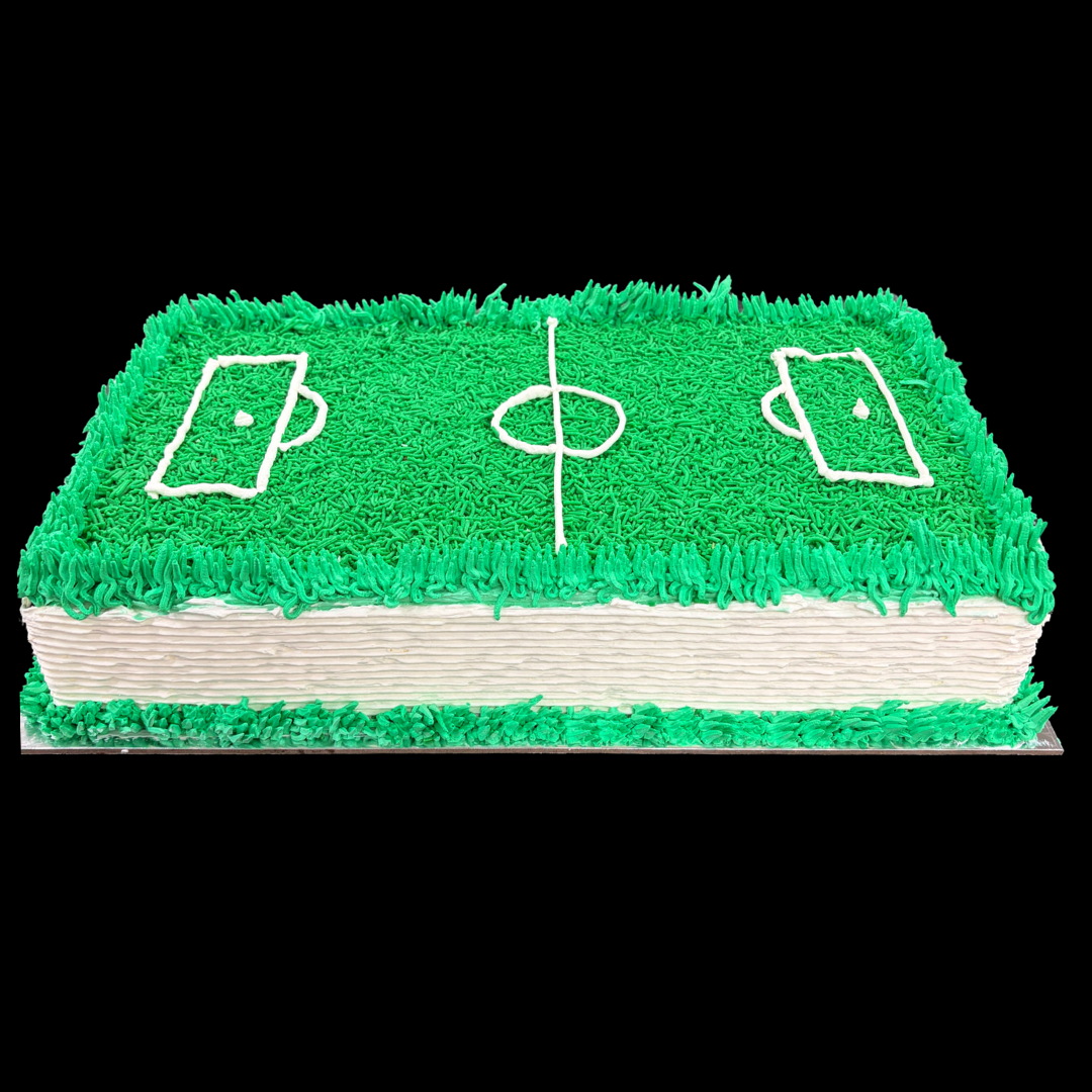 Cake designed to look like a sports field with green grass and white lines on a black background