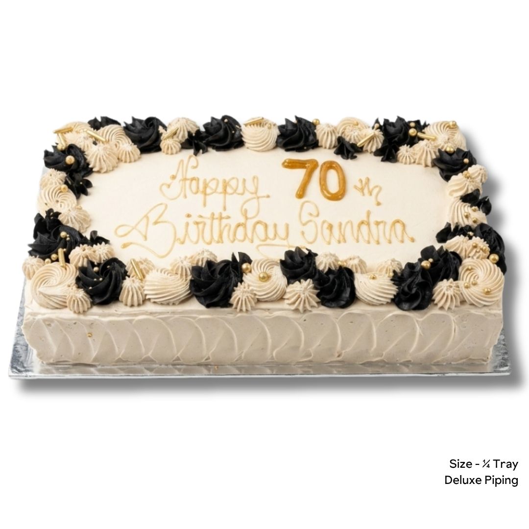 Birthday cake with beige and black deluxe piping and gold birthday message